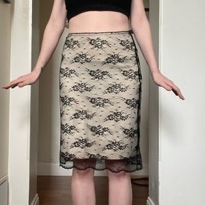 The limited floral lace slip midi skirt